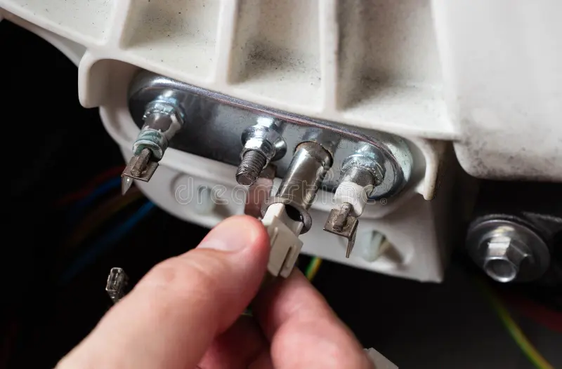 removing-electric-thermostat-sensor-washing-machine-repair-machines-close-up-industry-375621221